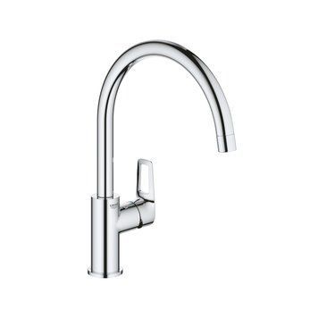 фотографія Смеситель для кухонной мойки Grohe BauLoop 31232001 изготовлен из высококачественной латуни с хромированным покрытием, имеет поворотное излияние с выносом 22,3 см. Модель устанавливается на одно отверстие и комплектуется шлангами подвода воды под диаметр